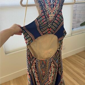 Vibrant, kaleidoscope pattern maxi dress with huge cut out back. Sexy side slits